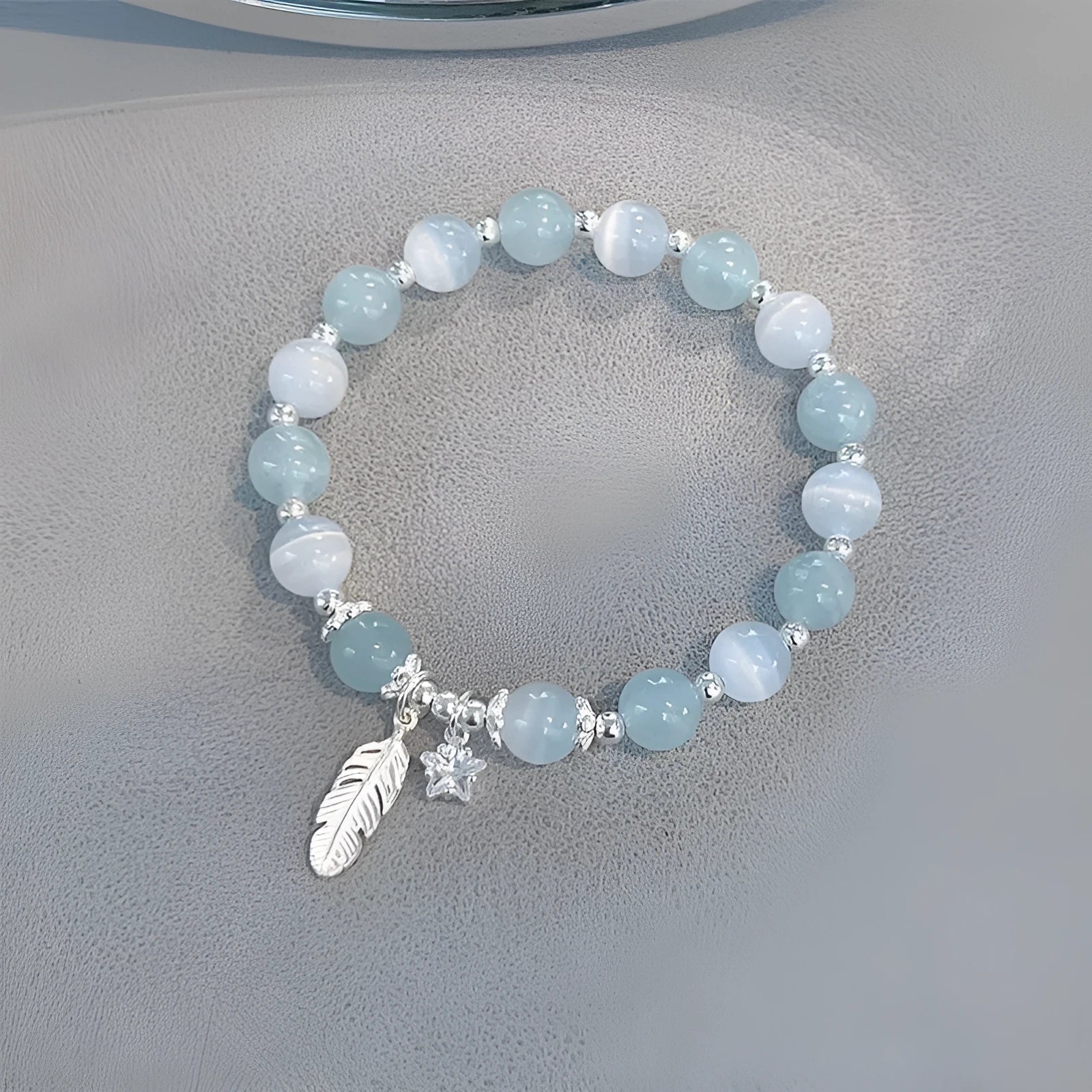 Small white girl crystal bracelet in feather XINGX blue moonlight with eight Awn star motif on wrist