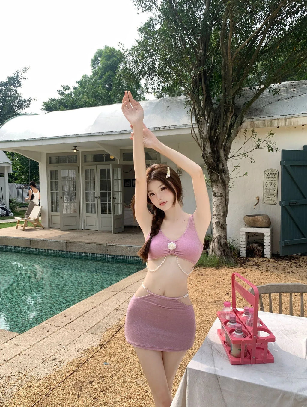 Three-piece bikini swimsuit in pink or black colours with briefs styling and sleeveless design for swimming