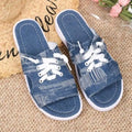 Blue women's Roman style flat canvas slippers with a cloth upper and rubber sole.