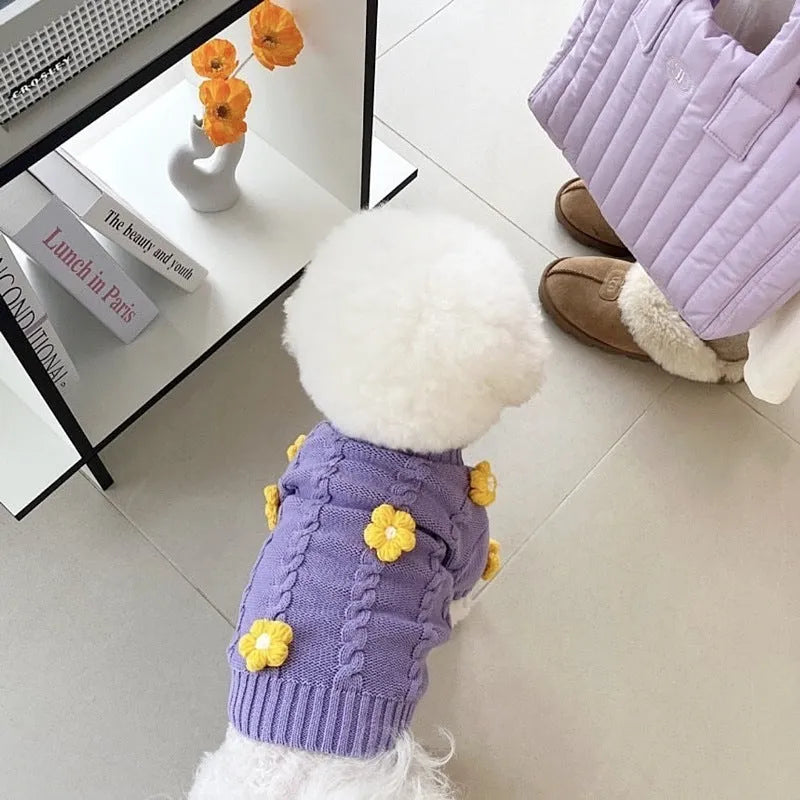 Purple knitted flower print dog coat on a pet showing pull-on style