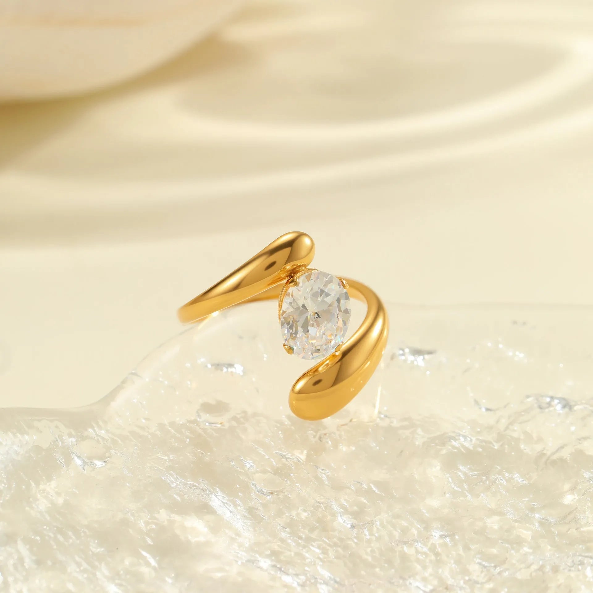 Adjustable geometric zircon ring in stainless steel with electroplated finish showing open-mouth design