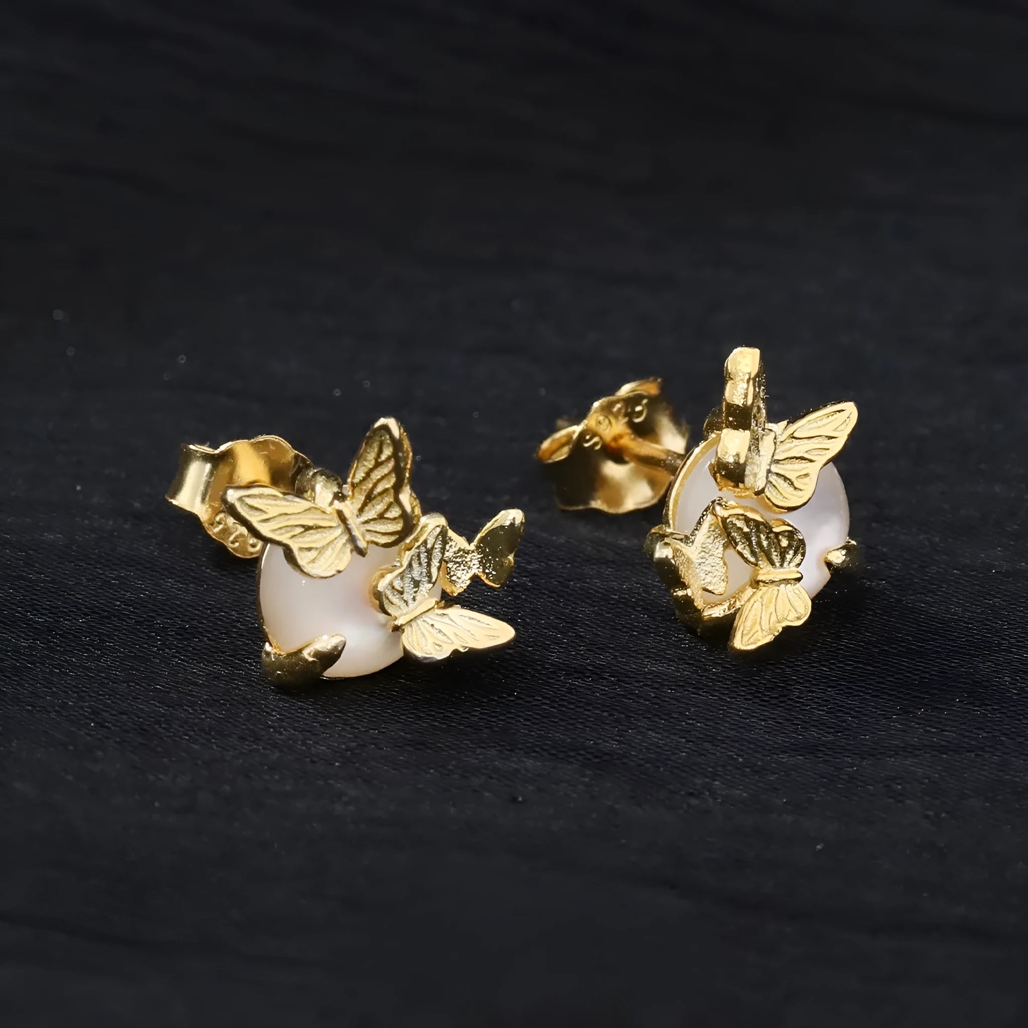 Butterfly ear studs in gold or white gold finish on 925 silver with animal zodiac design