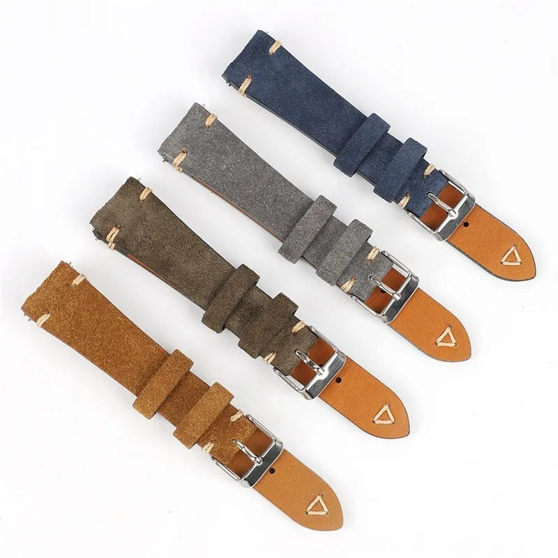 Brown genuine suede leather watch strap showing textured surface and buckle, laid flat.