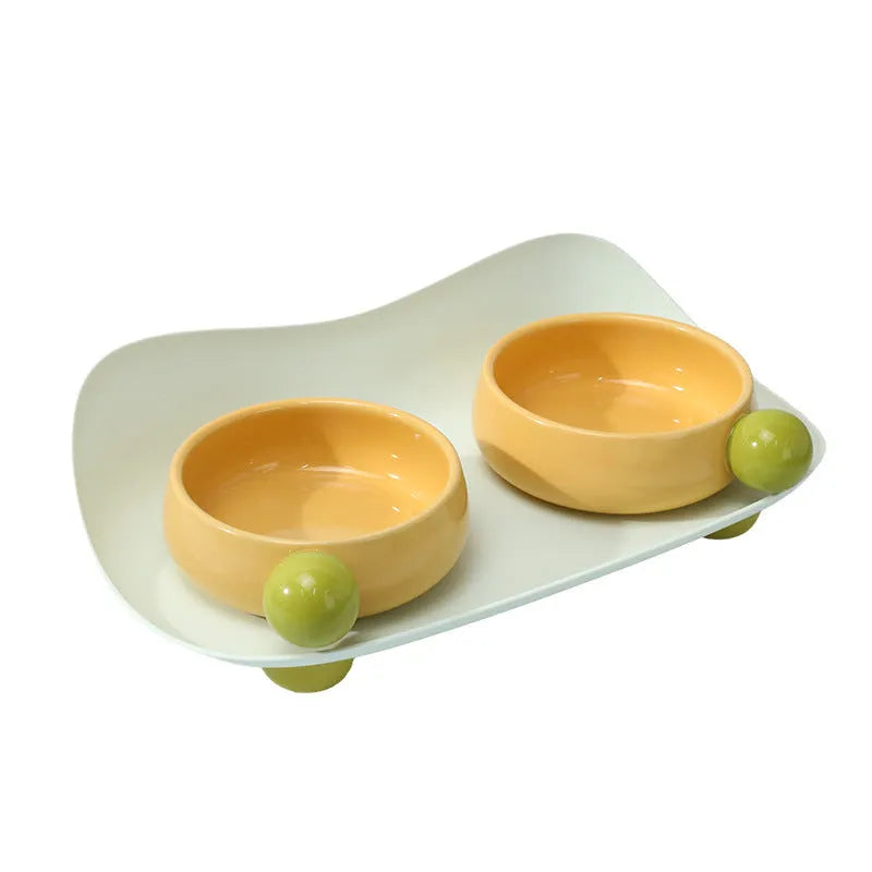 Two elevated ceramic pet bowls in a choice of colours, with a non-slip base, for cats and small dogs.