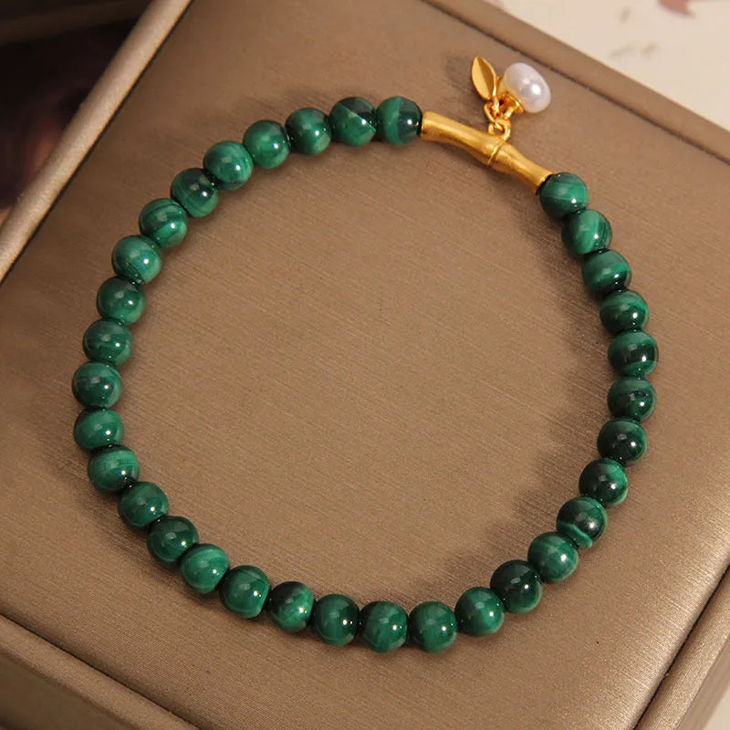 Women's lucky bamboo bracelet with white crystal beads on adjustable gold-toned chain