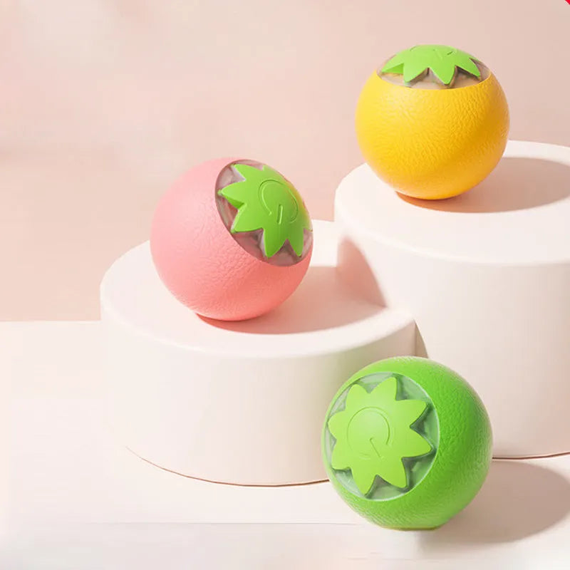 Automatic rolling ball toy for dogs and cats in green colour on floor