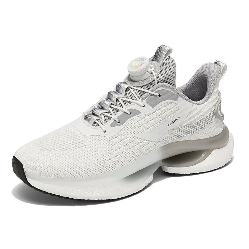 Men's white low-top running shoe with a rotating silver buckle on a grey background.