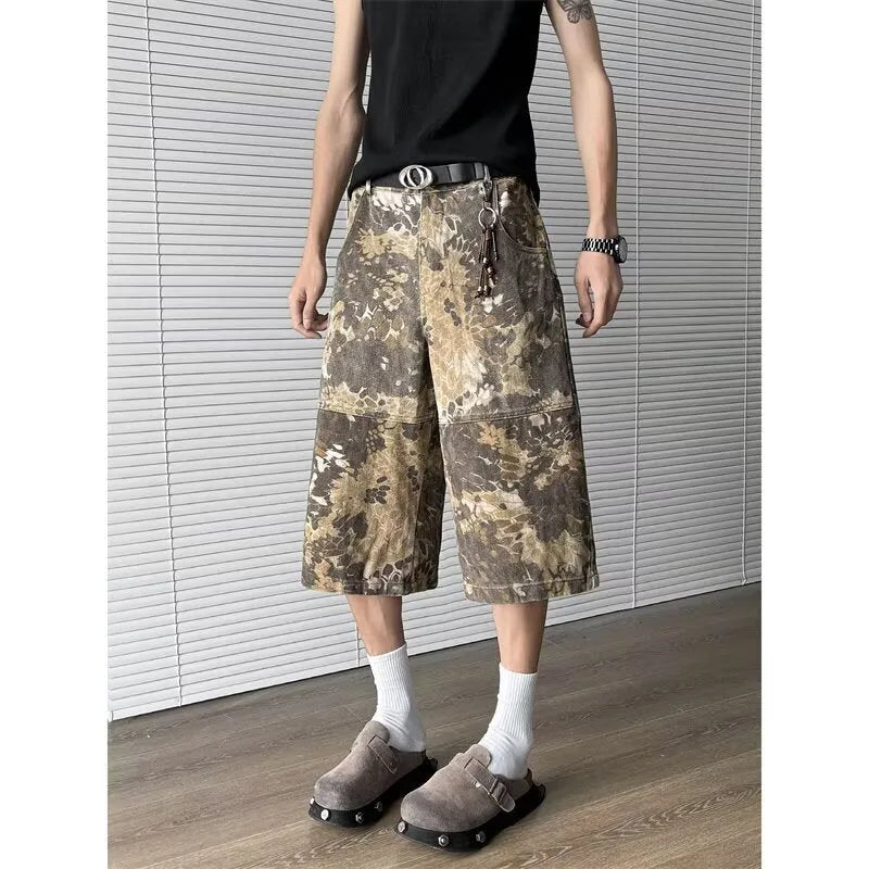 Yellow jeans with snake pattern camouflage design in cropped length
