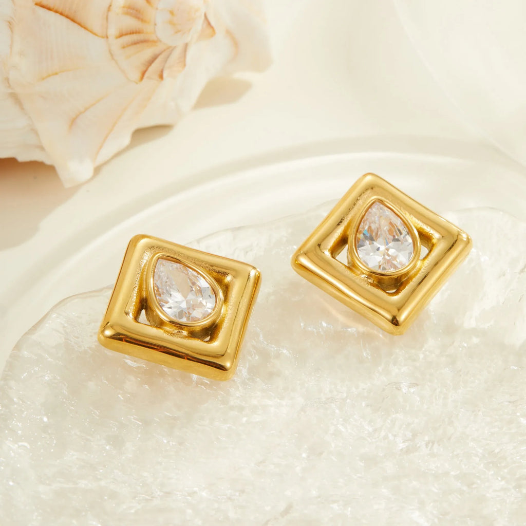 Gold-coloured geometric stud earrings with inlaid water drop zircon stones