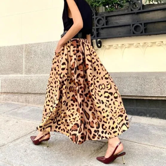 Brown leopard print women's A-line long skirt with a big hem detail on a mannequin.