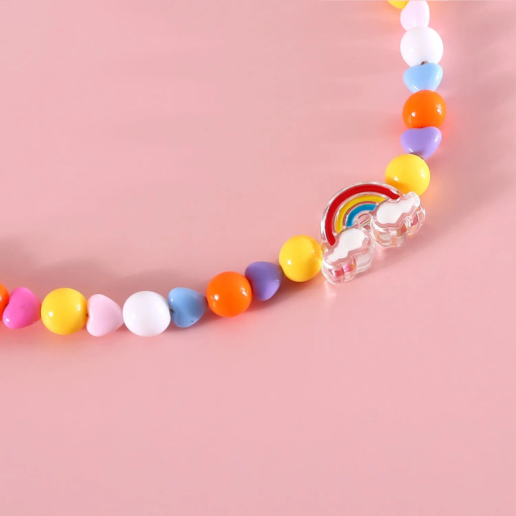 Colourful plastic bead pet necklace for dogs and cats in small flower, rainbow, or peach patterns.