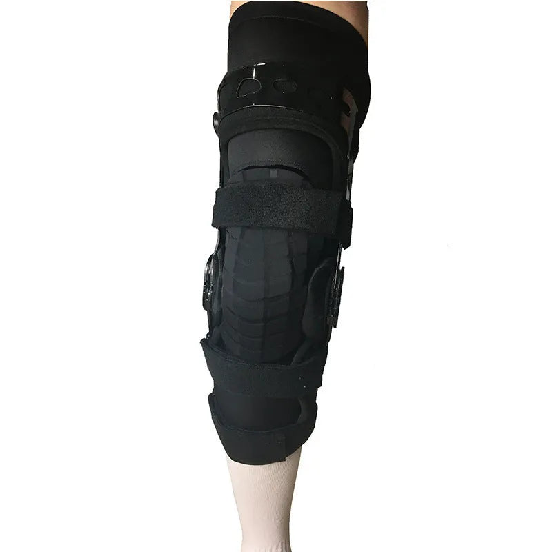 Black anterior cruciate ligament knee brace with visible metal side stays and hinges on a leg.
