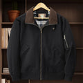 Men's camel washed cotton baseball jacket with a zip front and ribbed cuffs.