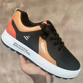 Men's casual shoes in white with black, brown or orange accents, round toe design, artificial PU upper