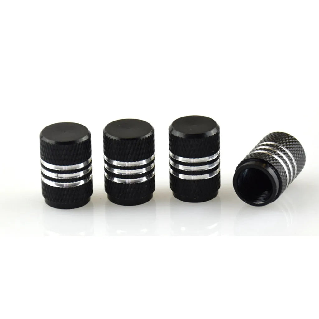Set of coloured stainless steel car tyre valve caps in ten colours on a white background