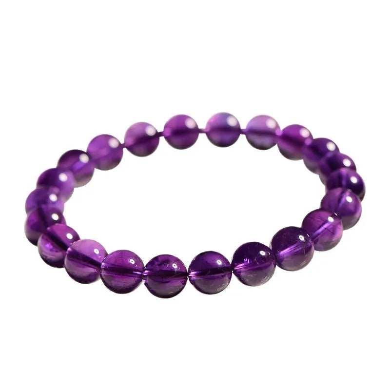 Natural Uruguayan amethyst scattered beads bracelet in various grades and sizes on a white background.