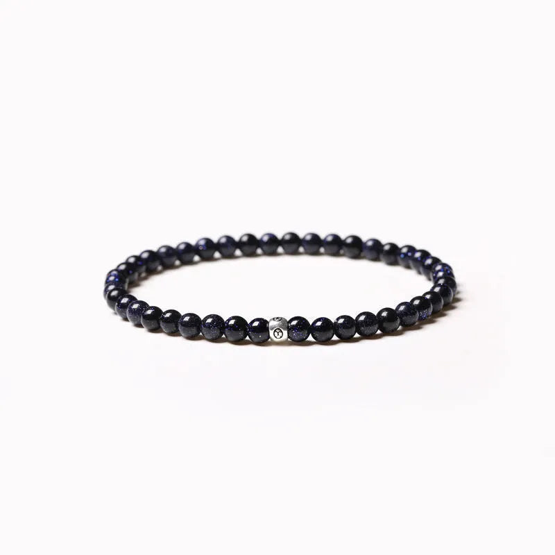 Geometric bracelet with obsidian, blue san and black agate beads showing round and chamfered square designs