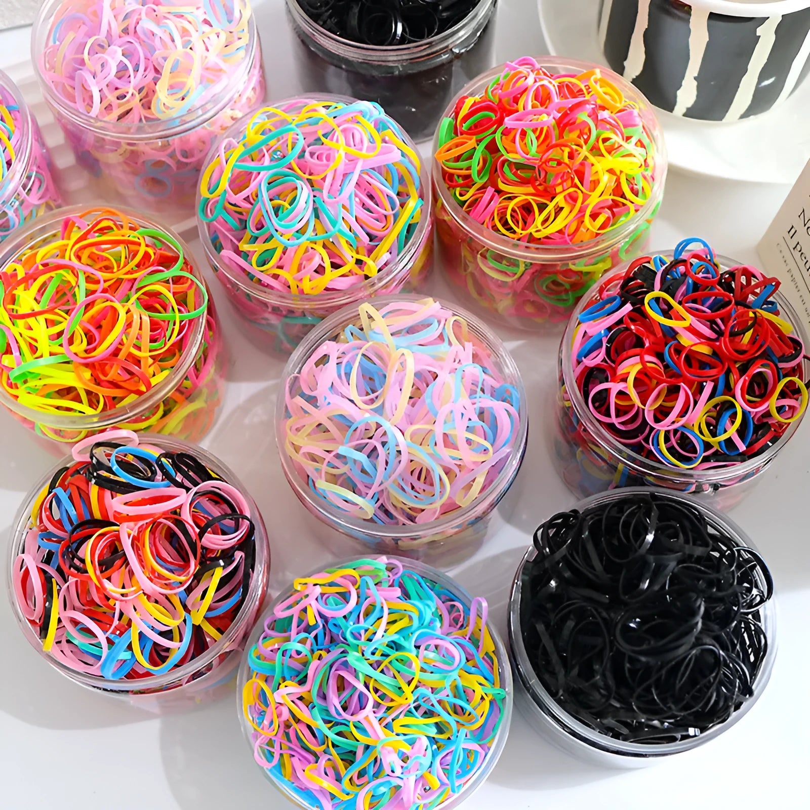 Multi-colour TPU baby hair ties in a reusable container for toddler fine hair, 300 piece pack