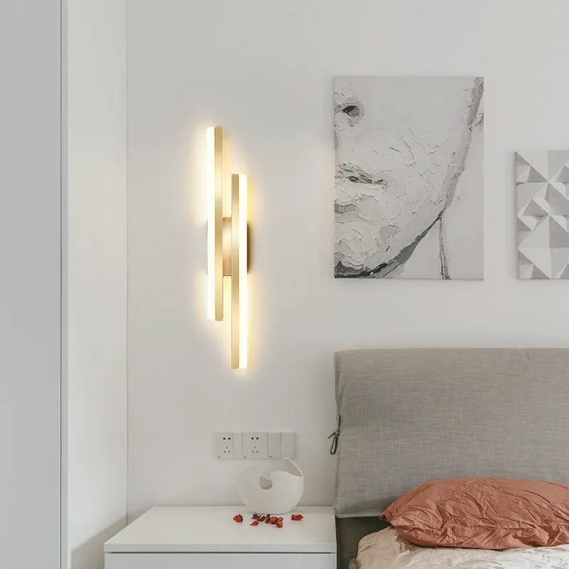 Scandinavian minimalist LED wall light with acrylic shade on black metal arm.