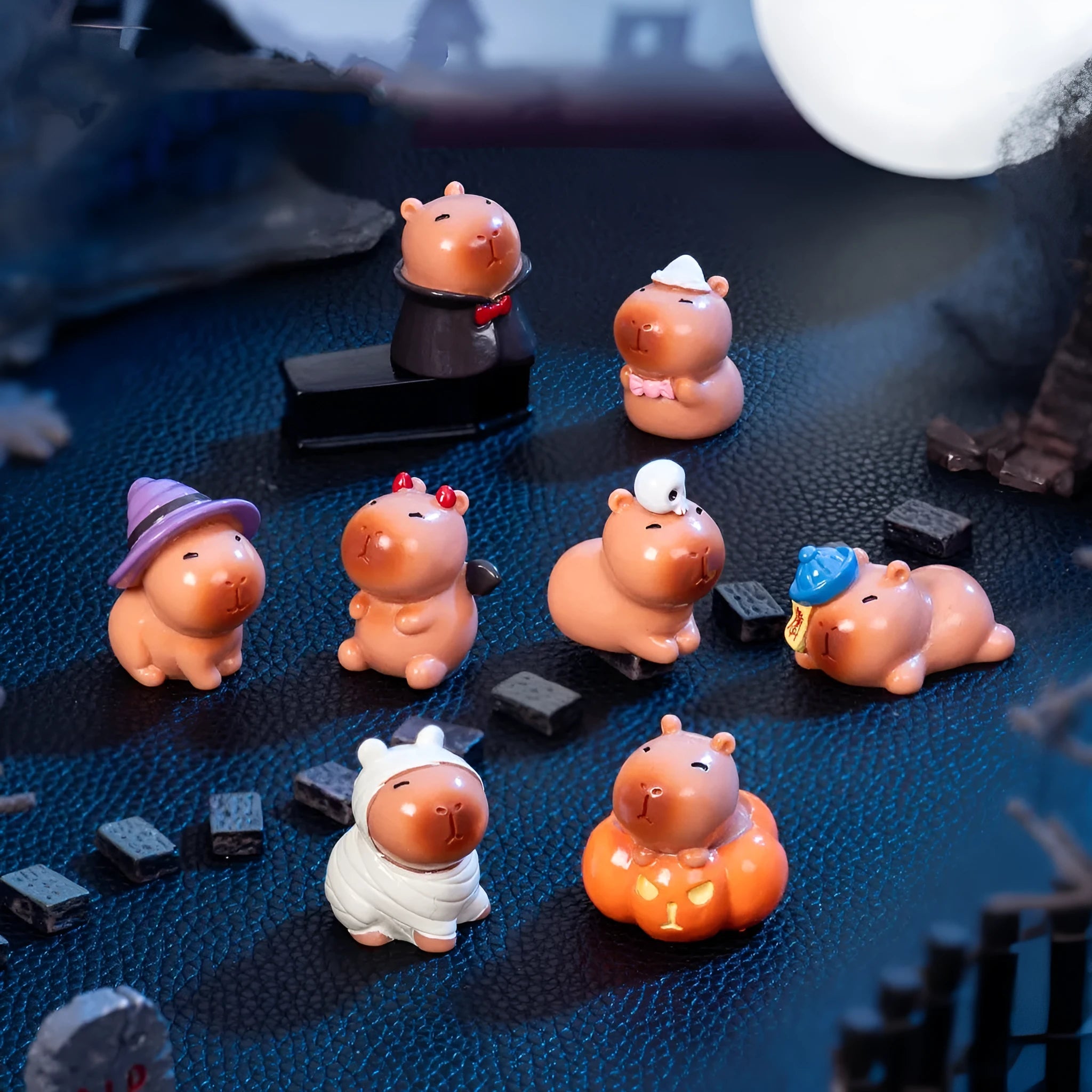 Eight cute Halloween capybara resin figurines including pumpkin, zombie, ghost, mummy, vampire, witch hat, little devil, skull