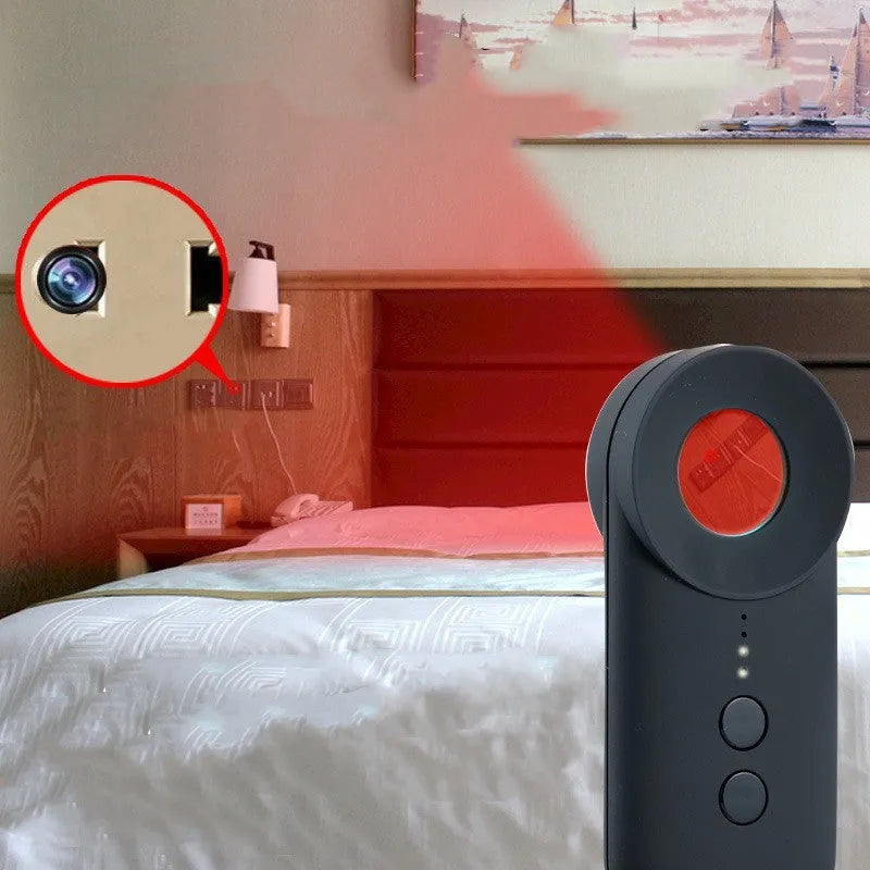 Black handheld GPS and hidden camera detector with USB port on a compact ABS plastic body.