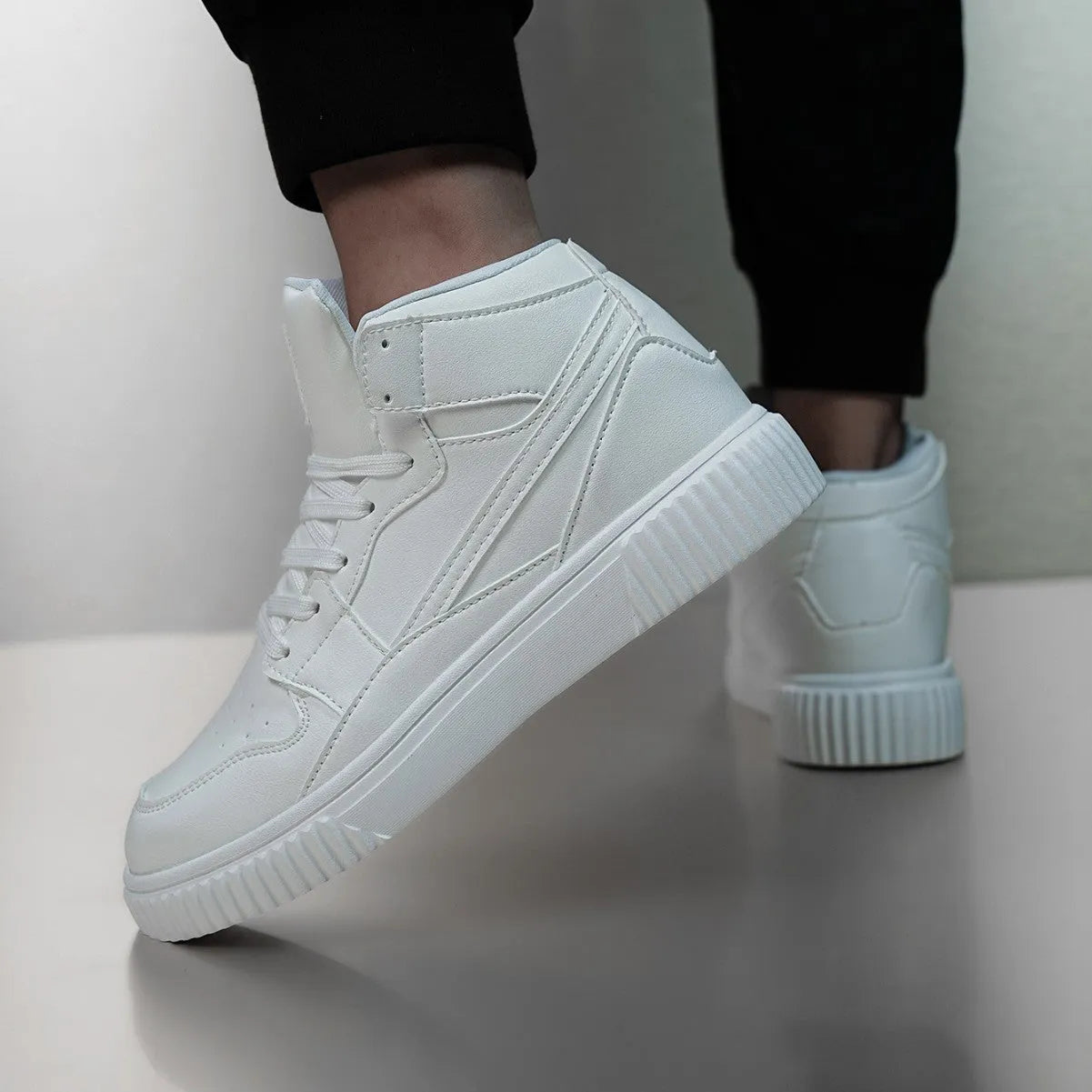 Men's white round toe casual sneakers with a microfiber upper on a grey background.