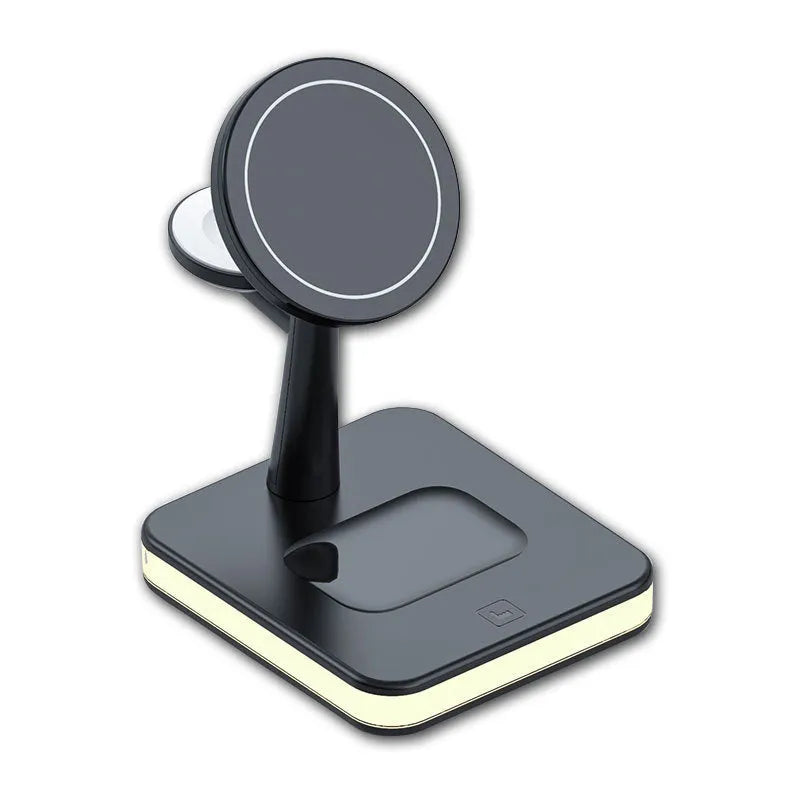 Three-in-one magnetic wireless charger with night light holding an iPhone, Apple Watch, and AirPods on a desk