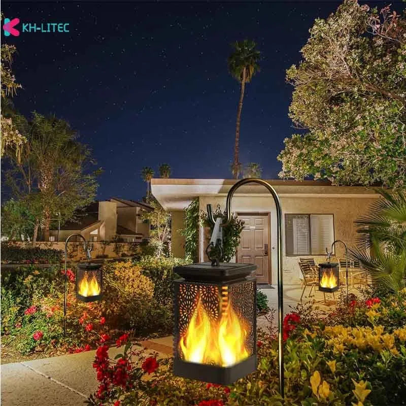 Set of four black solar flame torch lights with flickering LED effect for garden decoration