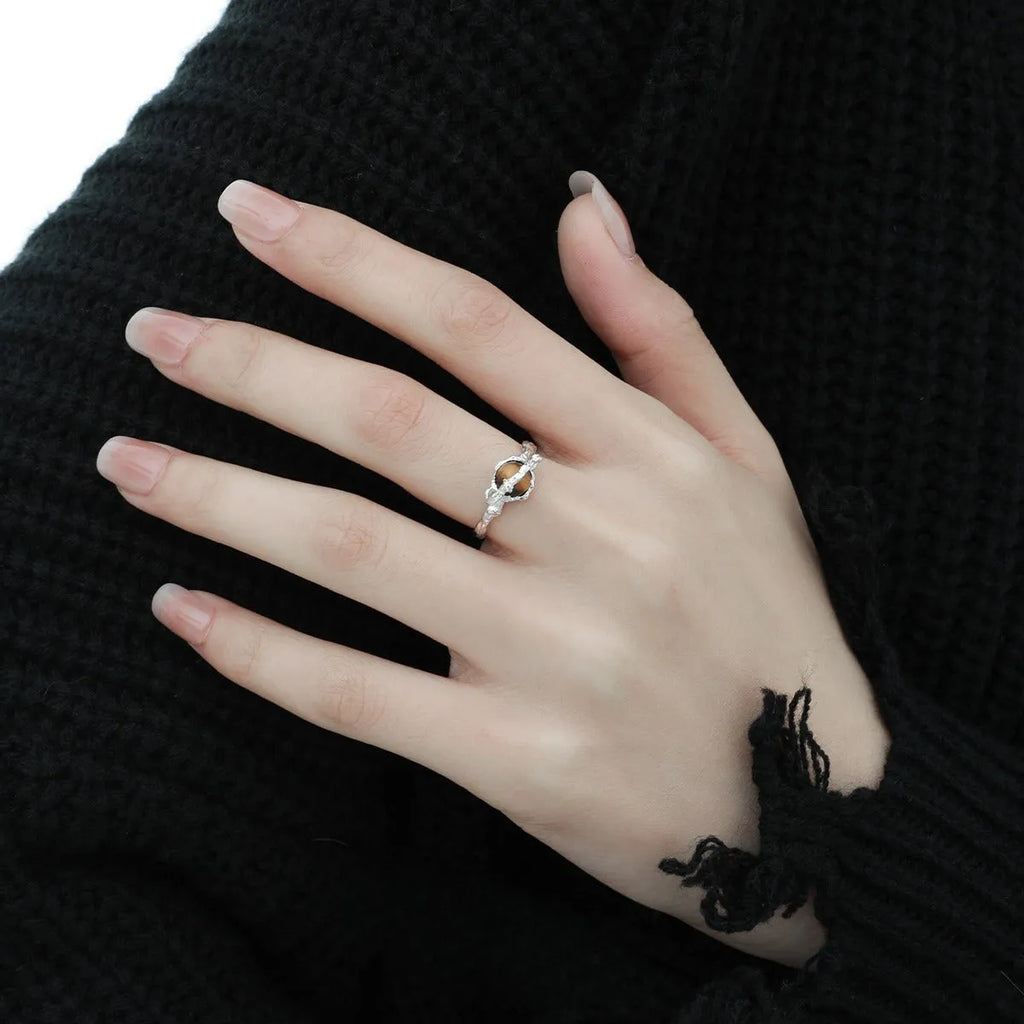Saturn-inspired adjustable open ring with white gold electroplated finish and silver base