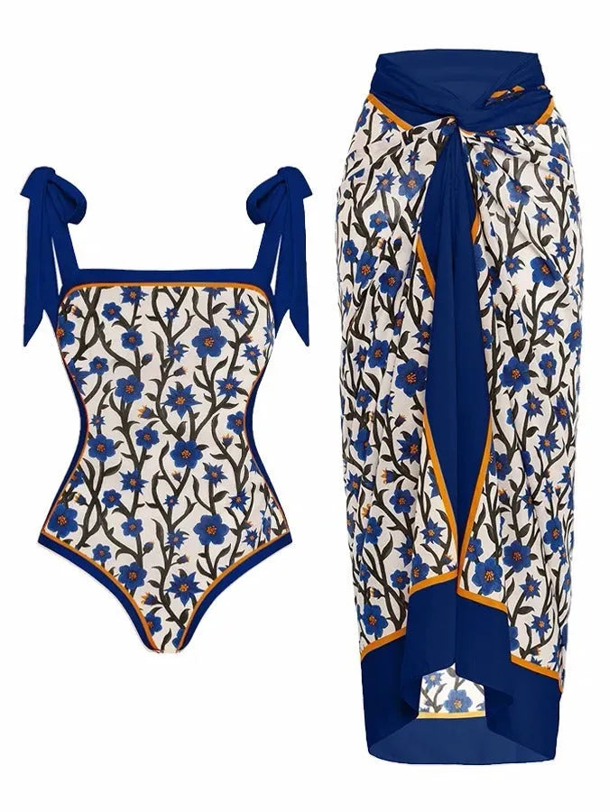 Women's floral printed two-piece swimsuit with matching skirt on a mannequin