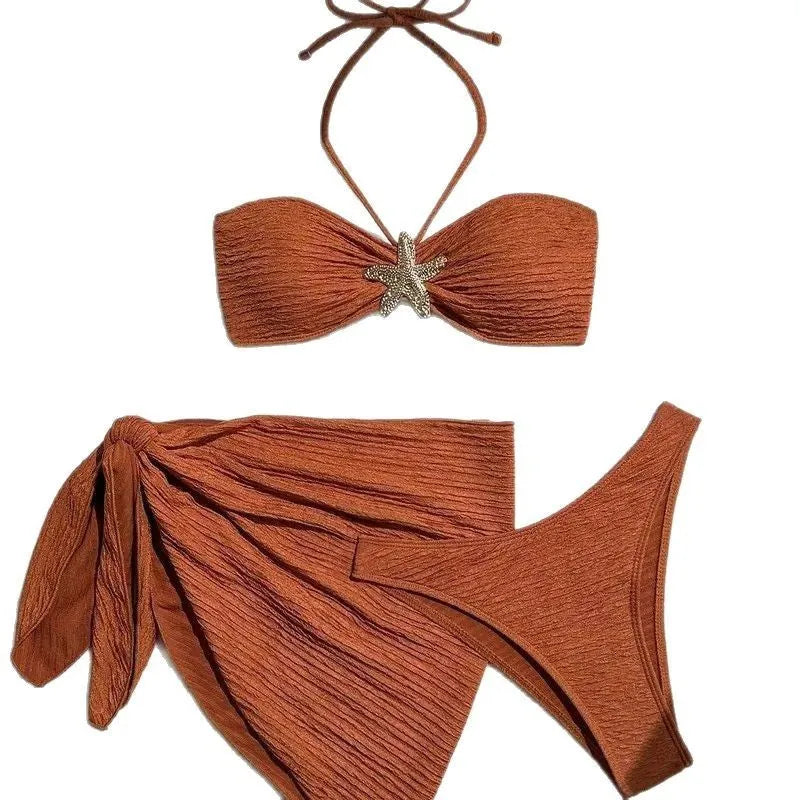 Brown floral three-piece swimsuit set with tube top, pants, and skirt on a model