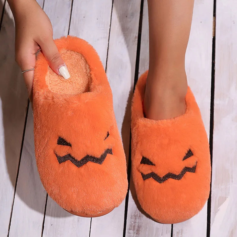 Orange plush-lined indoor slippers with non-slip PVC soles and coral velvet upper