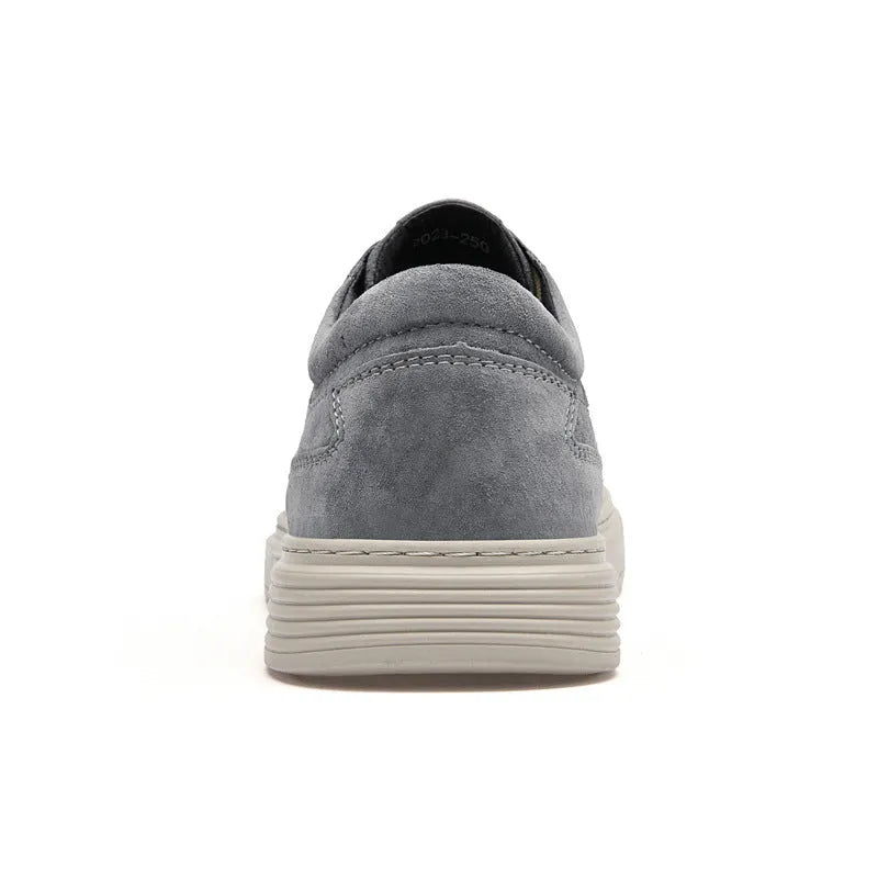 Men's grey casual leather skate shoes with lace-up front and rubber sole