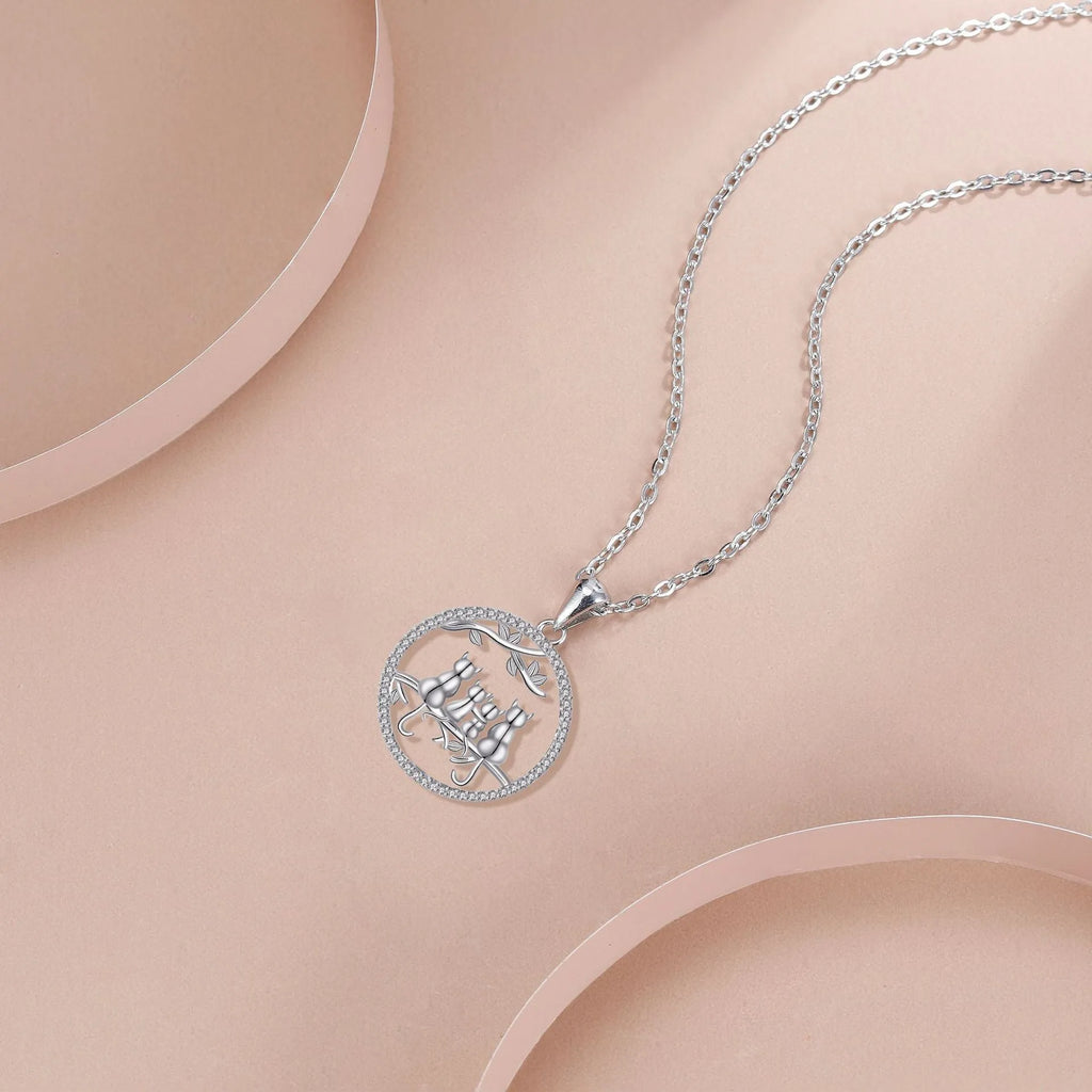 Women's four kitten necklace with copper pendant and cross chain in electroplated finish