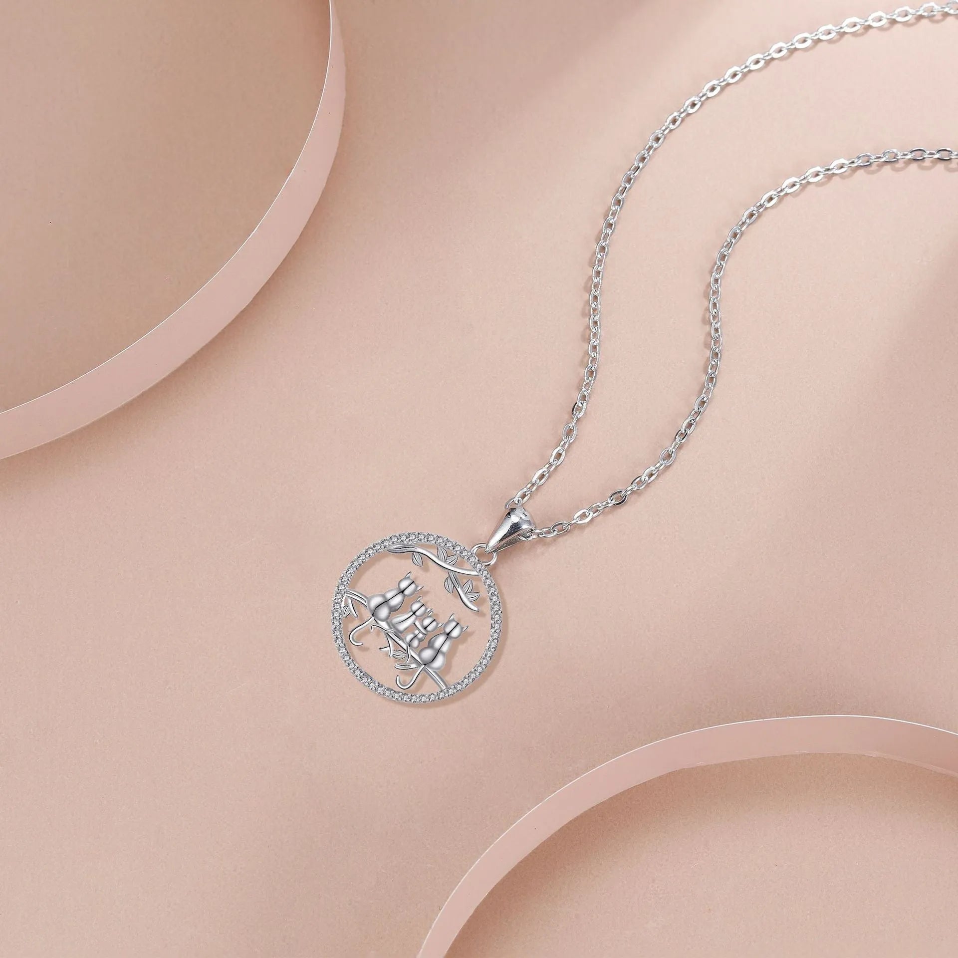 Women's four kitten necklace with copper pendant and cross chain in electroplated finish