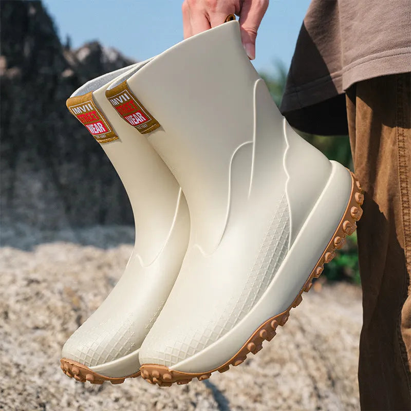 Men's mid low tube rain boots with non-slip sole and PVC upper in black