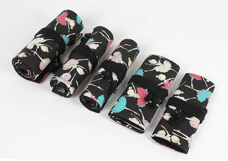 Square canvas pencil case with ballet girl print, showing multiple holes for organising pencils and stationery.