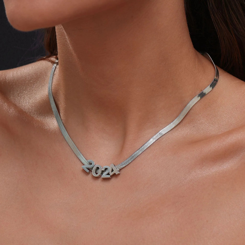Gold and silver titanium steel necklaces with letter, number, and heart pendants on 40cm chains.