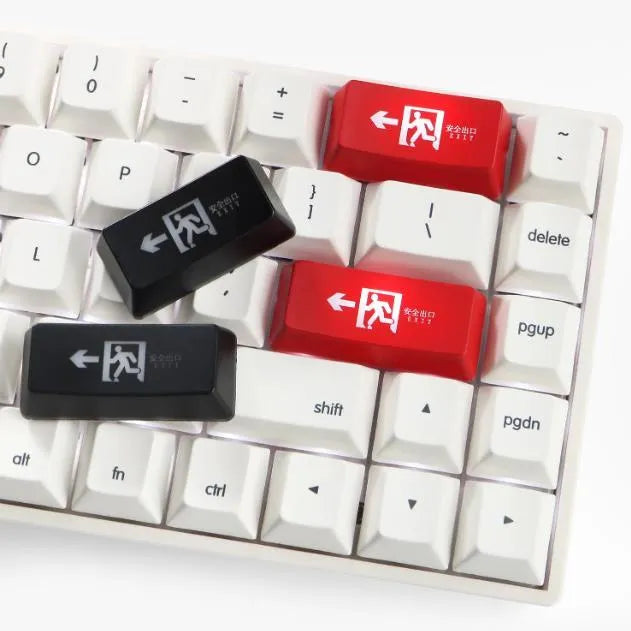 Red safety evacuation exit backspace key cap on a USB keyboard with transparent plastic construction