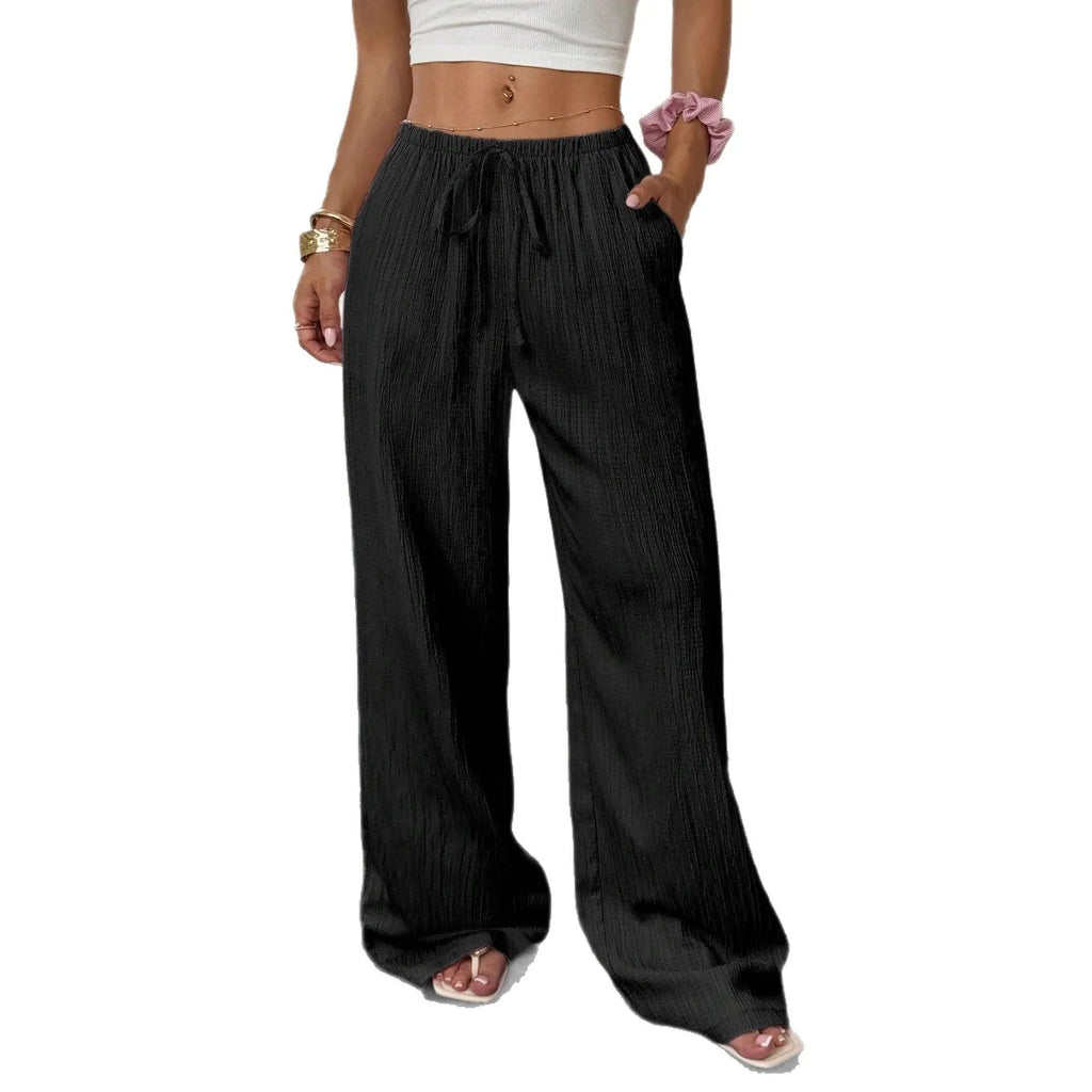 Women's black wide-leg trousers with lace-up waist trimming detail on mid waist