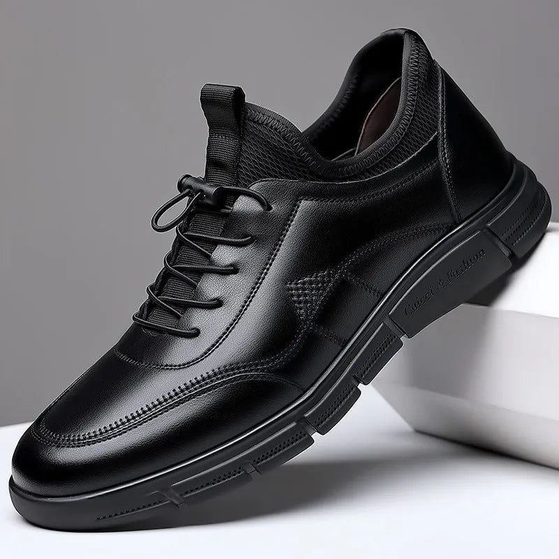 Men's black low heel casual shoes with round toe and square heel on a plain background