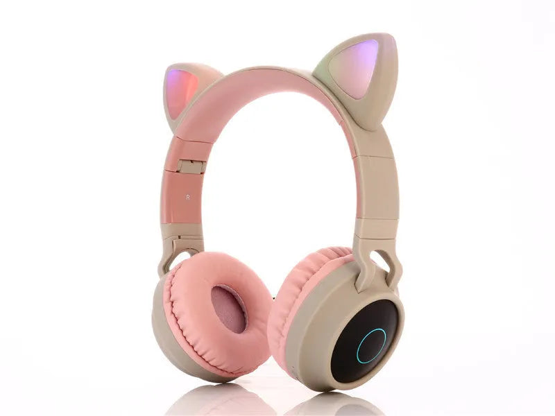 Pink cartoon cat ears wireless Bluetooth gaming headset showing head-mounted design and bilateral earpieces.