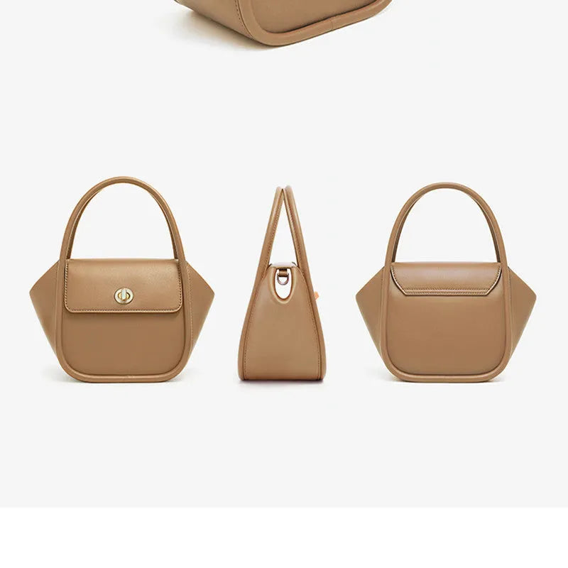 Soft wing-shaped leather cross-body tote bag in cow leather with a buckle and latch closure.