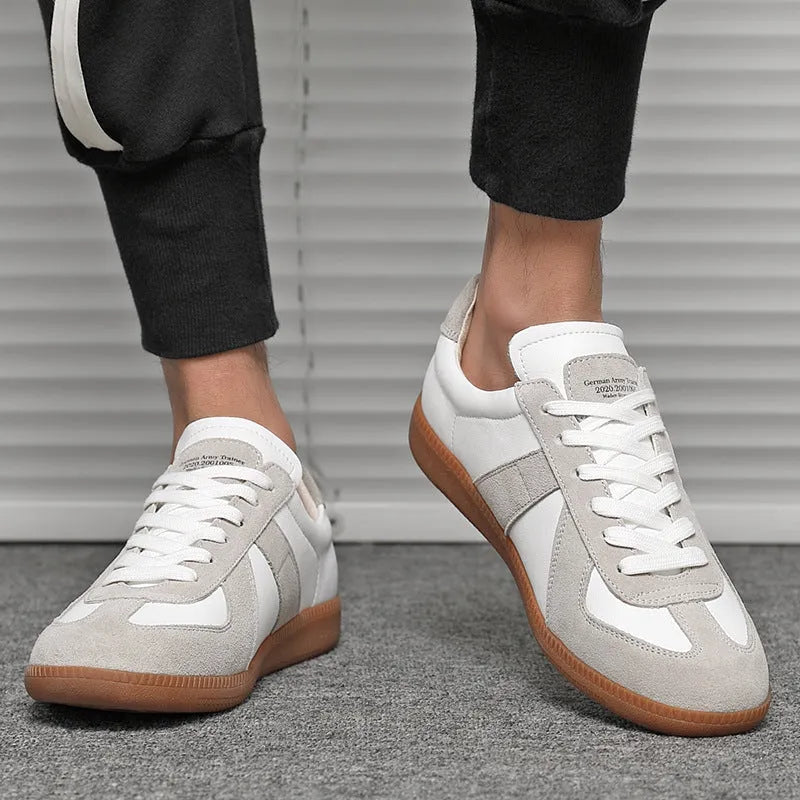 White Japanese-style retro unisex board shoes with mesh upper, rubber sole, and contrast stitching