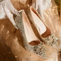 Champagne coloured bridal shoes with crystal rhinestones, pointed toe, and court heel.