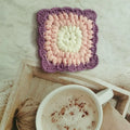 Crocheted wool grandmother lattice insulated cup placemat in four colours Emerald Sea Salt Blue Dream Purple Fog Brown