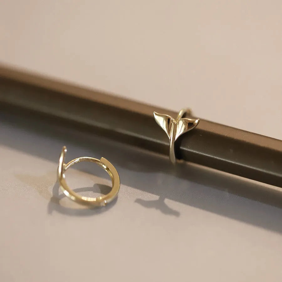 S925 sterling silver fishtail earrings with 14k gold plating in gold and white gold colours.