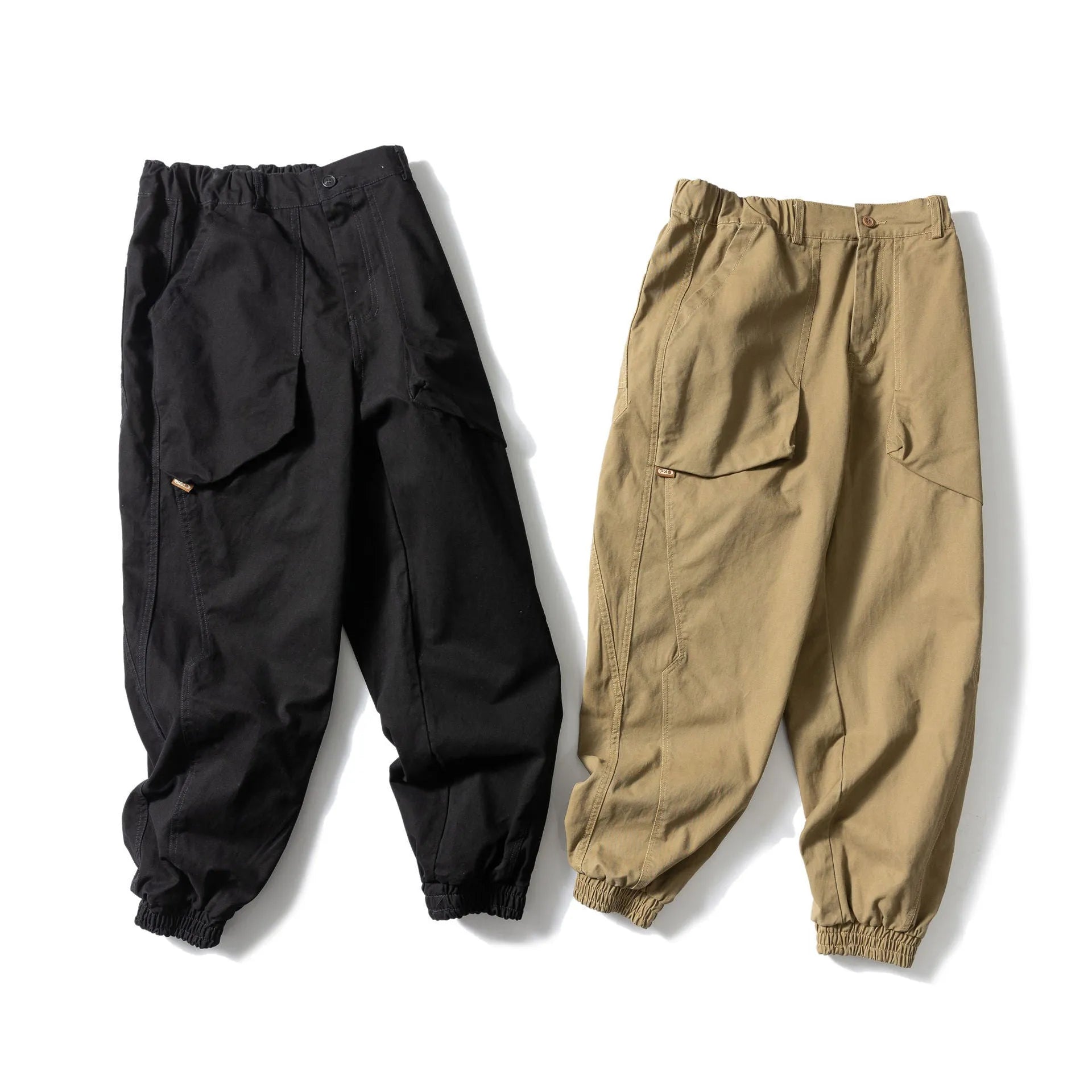 Solid colour cotton tapered casual pants with ankle ties, loose fit, available in black and khaki.