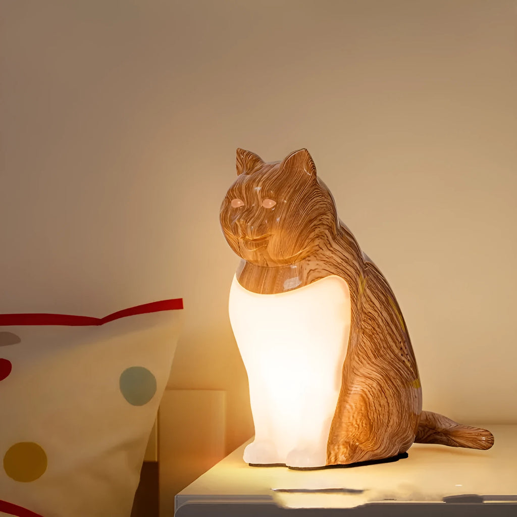 Cat USB charging night light with 2600mAh battery, three colour temperatures, and wood grain base on a bedside table