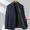 Men's loose fit solid colour wool blend coat for casual spring and autumn wear.